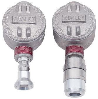 Two RKI Instruments Direct Connect Gas Sensors (LEL, CH4, HC, CO2) include specialized fittings at the bottom for improved compatibility with remote gas detection systems. The unit on the left features a narrower fitting, while the one on the right has a wider fitting. Both are marked with bright red labels beneath their main bodies.