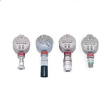 Four RKI Instruments S2 Fixed Gas Sensor/Transmitters, with round metal tops and cylindrical bases, are lined up against a white background. Each sensor, designed for explosion-proof construction, showcases a distinctive colored detail on its base.