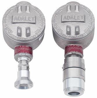 Two cylindrical metal junction boxes branded as "ADALET" are designed for explosion-proof environments, featuring threaded components at the bottom. They vary slightly in size and design with raised ridges, making them suitable for use with RKI Instruments' RKI Direct Connect Gas Sensor (O2, H2S, CO).