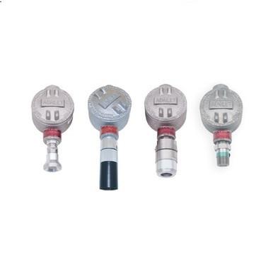 Four RKI Instruments S2 Fixed Gas Sensors/Transmitters, featuring a metal design with round tops, cylindrical connectors, and explosion-proof construction, are arranged in a row against a white background.