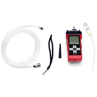 The RKI Instruments GX-2012 5-Gas Detector is designed for confined space entry and features a display with buttons, a coiled hose, wrist strap, nozzle, and connector. This red and black device from RKI Instruments employs micro-sensor technology for efficient monitoring via its digital screen.