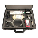 A black case containing the RKI Instruments GX-2012 5-Gas Detector Kit, featuring micro-sensor technology with canisters, tubes, a digital device, and a charging plug, all set in custom foam compartments.