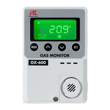 The RKI OX-600 Indoor Stand Alone Oxygen Monitor 72-100_ by RKI Instruments is a sophisticated oxygen monitor that includes a galvanic cell sensor and a digital display indicating an oxygen level of 20.9%. Designed specifically for indoor use, it features dedicated buttons for mode and settings adjustments, along with a white body enhanced by a green screen.