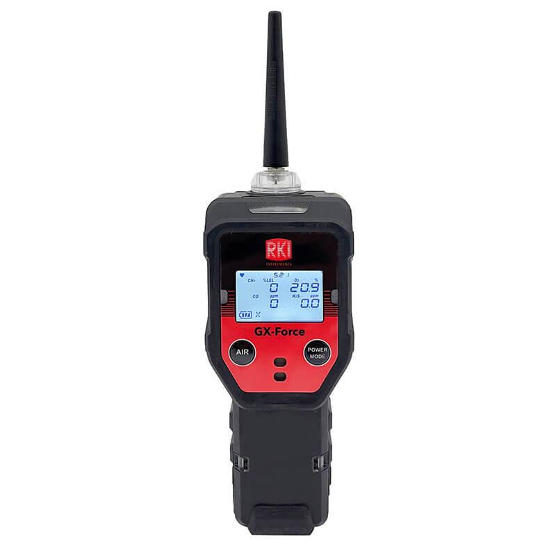 The RKI Instruments GX-Force Sample Draw 4 Gas Monitor 72-FA-A-A10 is a handheld device with a black and red exterior, ideal for leak investigations in confined spaces. It features a display screen for measurements, two buttons labeled "AIR" and "POWER MODE," and an antenna extending from the top.