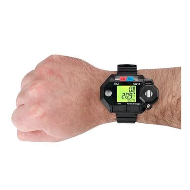 A person wearing an RKI Instruments GasWatch 3 CO/O2 Gas Personal Monitor 73-0026, which features a black, rectangular digital screen displaying "209" along with other information in green digits, similar to the precision of a CO/O2 sensor.