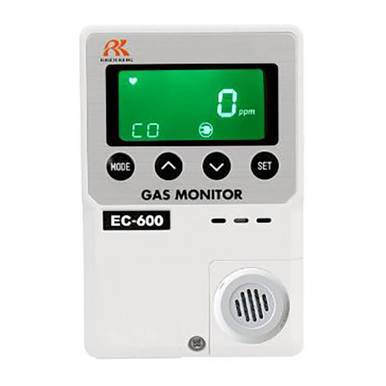 The image shows an RKI Instruments Indoor CO Diffusion Gas Monitor 24 VDC, model EC-600. It is equipped with an electrochemical sensor and a green digital display indicating "0 ppm" for carbon monoxide. The monitor features buttons for mode and settings, as well as a round speaker vent below.