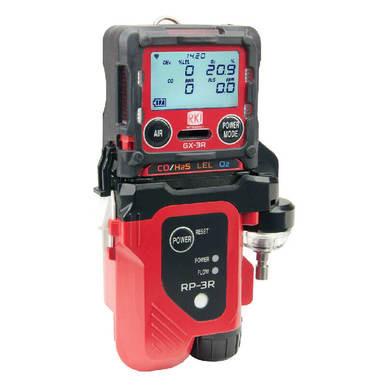 The RKI RP-3R Sample Drawing Pump for GX-3R by RKI Instruments is a compact gas detector designed for confined space entry, featuring a digital display screen for precise measurements. The device includes controls labeled "AIR" and "POWER MODE," along with visual indicators and branding in an elegant black and red design.