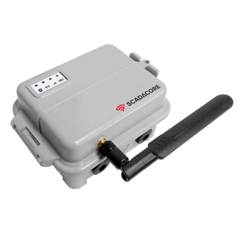 The image showcases an RKI Telemetry Hardware device, ideal for remote monitoring in industrial settings. It features a gray rectangular casing with an external antenna, an antenna connector on the side, and a small display panel on top. The brand logo and name of RKI Instruments are printed in red and black.