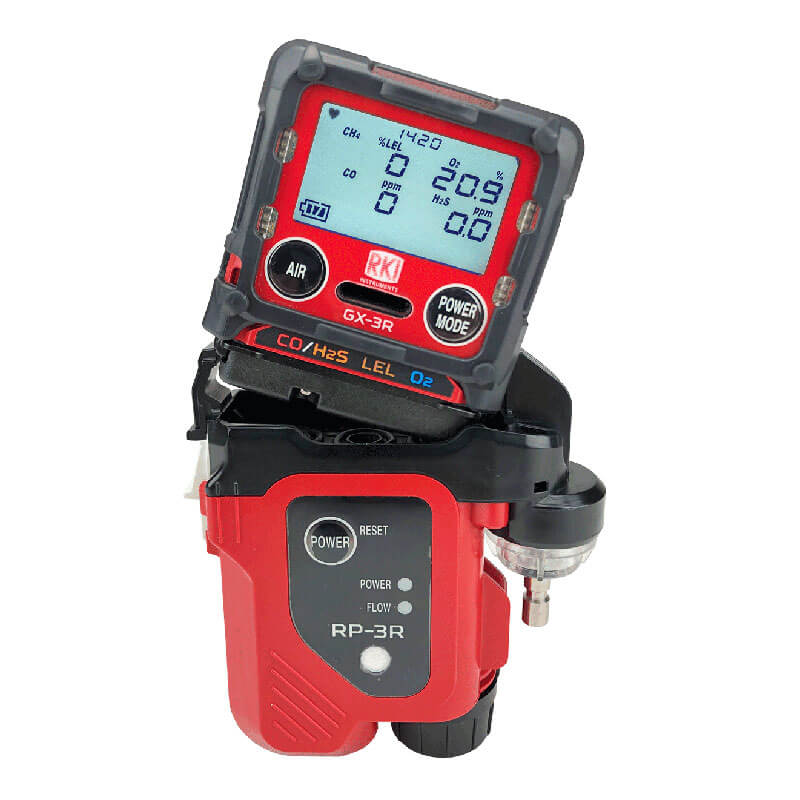 The RKI Instruments GX-3R with Pump Bundle is a red and black multi-gas monitor for CO, H2S, LEL, and O2 with a digital display, attaches to an RP-3R device—ideal for confined space detection.