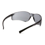 A pair of Pyramex Safety Ztek Safety Glasses S2510S (12/box) with sleek black frames, tinted lenses, curved arms, and wide side protection sits on a white background. They meet ANSI Z87.1 standards for reliable eye protection.