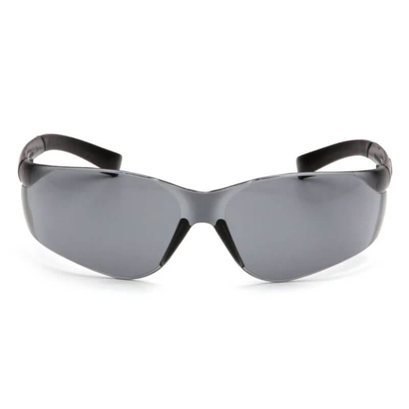 A pair of Pyramex Safety Ztek Safety Glasses S2510S with dark tinted lenses and curved arms is shown from the front against a white background.