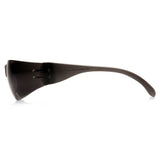 Side view of Pyramex Intruder Anti-fog Safety Glasses S41_0ST by Pyramex Safety, featuring a wide lens, impact protection, and curved arms, shown resting on a white surface.