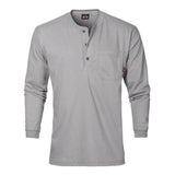 The Saf-Tech 6oz FR Cotton Henley HENL27, a gray long-sleeve shirt from Saf-Tech, features a buttoned placket, chest pocket, and red logo tag. It boasts moisture-wicking properties and flame resistance, offering an ideal combination of style and functionality against a plain white background.