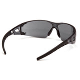 Pyramex Fyxate H2X Anti-Fog Safety Glasses by Pyramex Safety feature black wraparound frames, dark tinted lenses, curved arms, and a lightweight sporty design for reliable impact protection. Shown resting on a white surface.