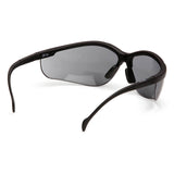 A box of Pyramex Venture II V2 Reader Safety Glasses by Pyramex Safety, featuring black wraparound bifocal frames with dark tinted lenses, shown angled from the back and side to highlight their curved design.