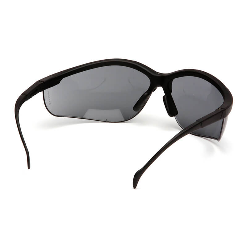 Pyramex Venture II Safety Glasses by Pyramex Safety, shown from a rear-side angle on a white background, offer reliable eye and UV protection in black wraparound style. Each box contains 12 pairs.
