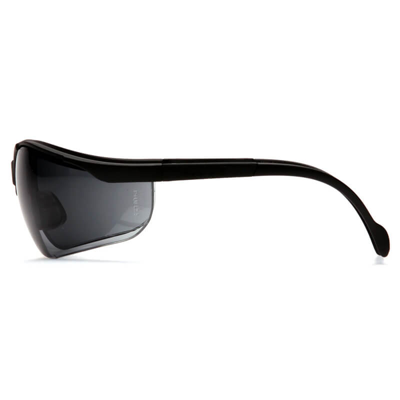 Side view of Pyramex Venture II Safety Glasses by Pyramex Safety, black frame with dark tinted lenses and curved arms, provides enhanced UV and eye protection; 12 glasses per box, displayed on a white background.