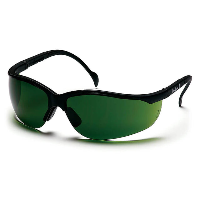 Introducing the Pyramex Venture II Safety Glasses 5.0 IR Filter by Pyramex Safety—sleek black eyewear featuring dark green IR filter lenses. These safety glasses boast a sophisticated design with wraparound arms and a smooth, curved frame, providing UV protection while delivering exceptional style. Available in a box of 12.