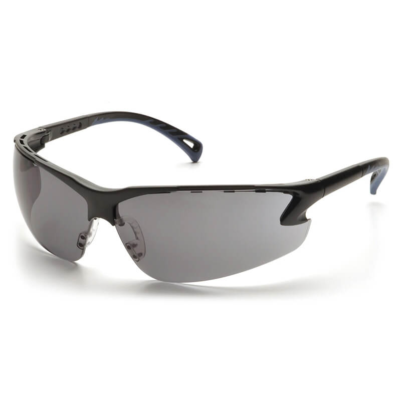 Featuring a sleek, black design, the Pyramex Venture 3 Safety Glasses SB57 by Pyramex Safety come with wraparound dark-tinted lenses and UV protection. Their slightly curved, aerodynamic frame adds to the stylish look, and the slim, ergonomic temples ensure a secure fit during active use. Available in boxes of 12.