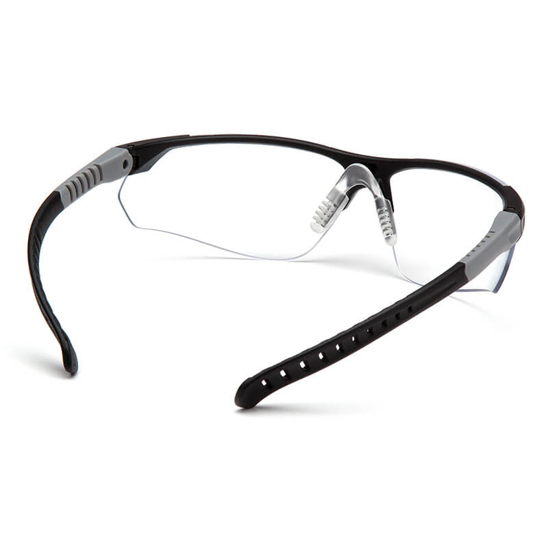 Pyramex Sitecore Safety Glasses SBG101_0DTM by Pyramex Safety feature a black/gray frame, clear anti-fog lenses, flexible textured adjustable temple arms, and adjustable nose pads for comfort and visibility. Sold 12 per box.