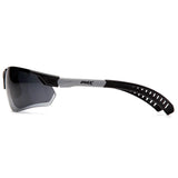 Side view of Pyramex Sitecore Safety Glasses SBG101_0DTM by Pyramex Safety, featuring a sporty black and white wraparound frame, dark tinted lenses with anti-fog coating, ventilated temple arms, and the "PMX" logo on the side.