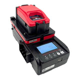 The RKI Instruments SDM-04 Calibration Station (Toxics) 81-SDM04SC-10_ is a black and red digital battery analyzer with a display, control buttons, and top battery mount—ideal for portable gas monitor calibration or bump testing.
