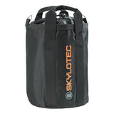 The Skylotec Rope Bag ACS-0009 is a black cylindrical bag featuring two handles and "SKYLOTEC" printed in orange vertically on the side. Ideal for storing climbing ropes, it secures with a drawstring and displays a round logo beneath the text.