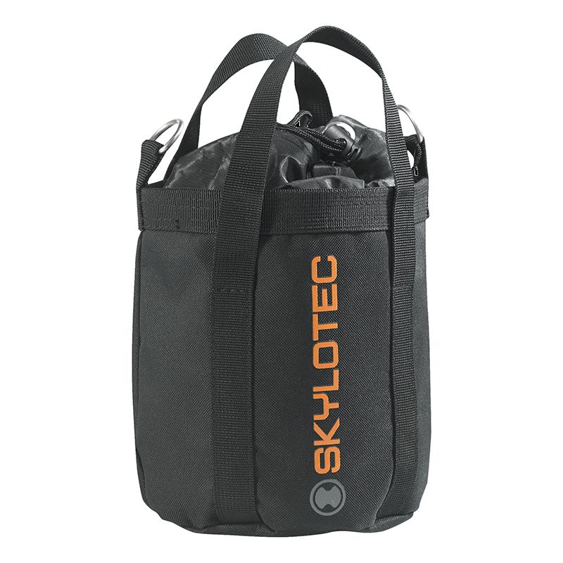 The Skylotec Rope Bag ACS-0009- in dark gray is perfect for your climbing adventures, featuring dual handles and an orange logo on the side. It ensures durability and security with its drawstring closure at the top, complemented by two metal clips that keep your climbing rope secure.