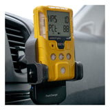 The WatchGas SST Range Wireless Car Charger SST-CAR-CHG is a yellow handheld gas detector by WatchGas, mounted on a black car vent holder with "FastCharge" and Qi-certified charging, showing numerical readings on its display inside the vehicle.