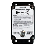 A close-up of the WatchGas SST1 Hybernation Starter SST1-HS device featuring an NFC symbol, quick start instructions, a light signal guide, and a metal button on the front panel—ideal for ensuring safety detector compliance tracking in industrial environments.