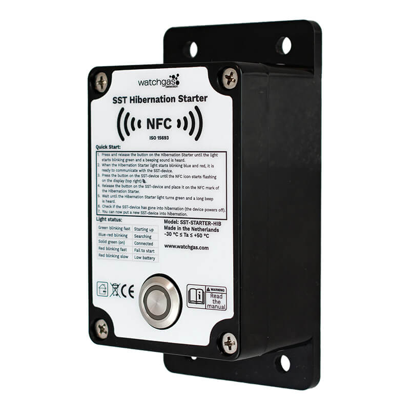 A black WatchGas SST1 Hybernation Starter SST1-HS by WatchGas, featuring an NFC symbol, quick start instructions, status indicators, and a large circular button mounted on a wall plate—ideal for compliance tracking and use as a safety detector.