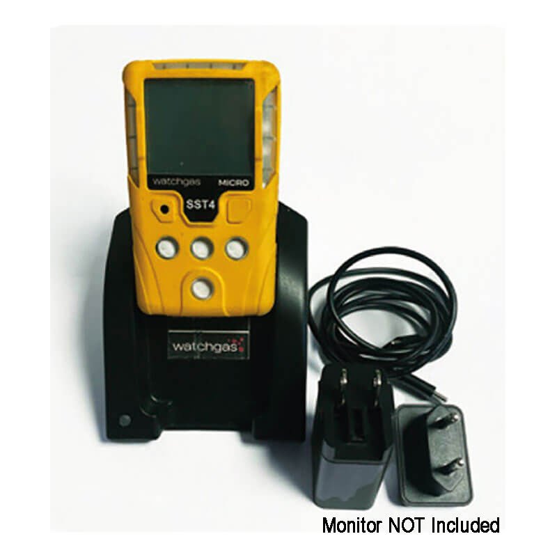 A yellow handheld gas detector rests in a WatchGas Induction Cradle Charger - Single Desktop w/Adapter, with a power adapter and cable nearby. Text in the image says, "Monitor NOT Included." Brand: WatchGas.