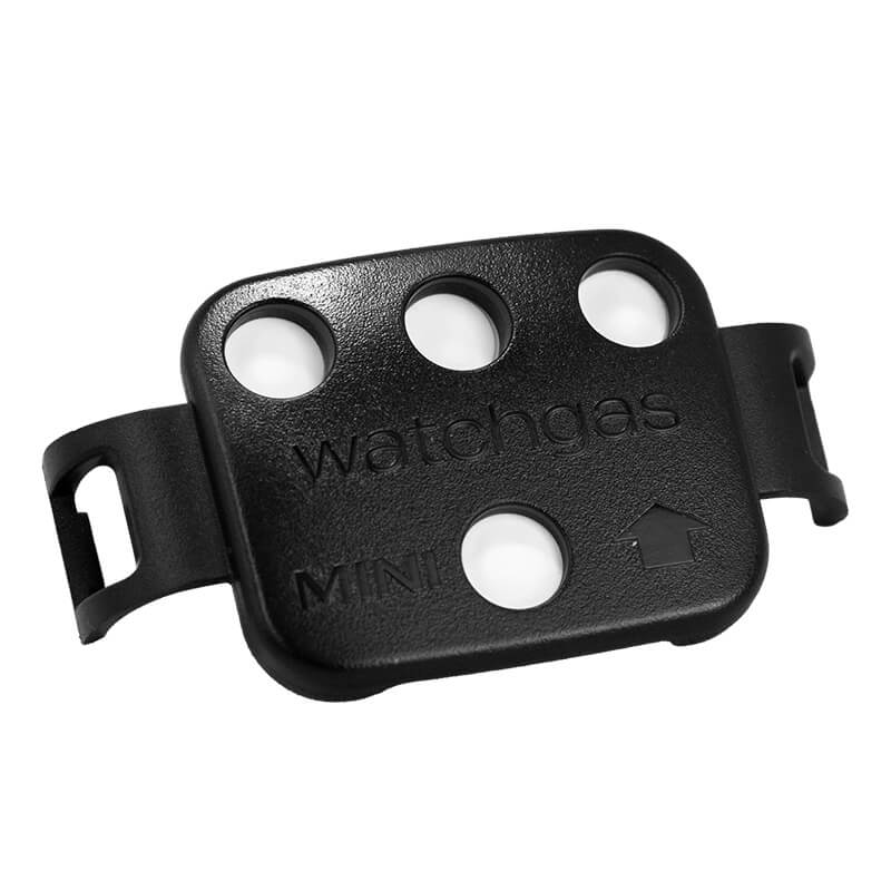 A small black device labeled “watchgas MINI,” featuring four circular holes, an arrow symbol, and two side clips, serves as a compact diffusion 4-gas detector engineered for efficiency and safety. Its gas detection performance can be further enhanced by fitting it with the WatchGas SST4-MINI External Filter (SST4-MINI-XFIL-10, 10 per pack) from WatchGas.