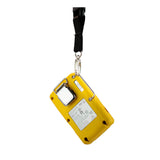A WatchGas SST Stainless Steel Lanyard Bar from the WatchGas SST Stainless Steel Lanyard Bar Kit (10/pack) is attached to a yellow handheld electronic device with a white label and metal clip, secured by a black strap against a white background—making it an essential accessory for those seeking reliable gas detector solutions.