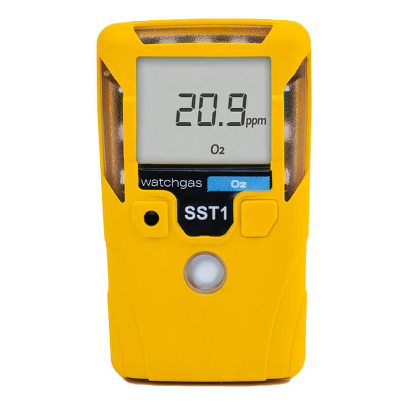A yellow WatchGas SST1 Serviceable O2 Gas Detector (SST1-O) shows 20.9 ppm O₂ on its digital display, featuring a solid polymer sensor and the WatchGas branding.