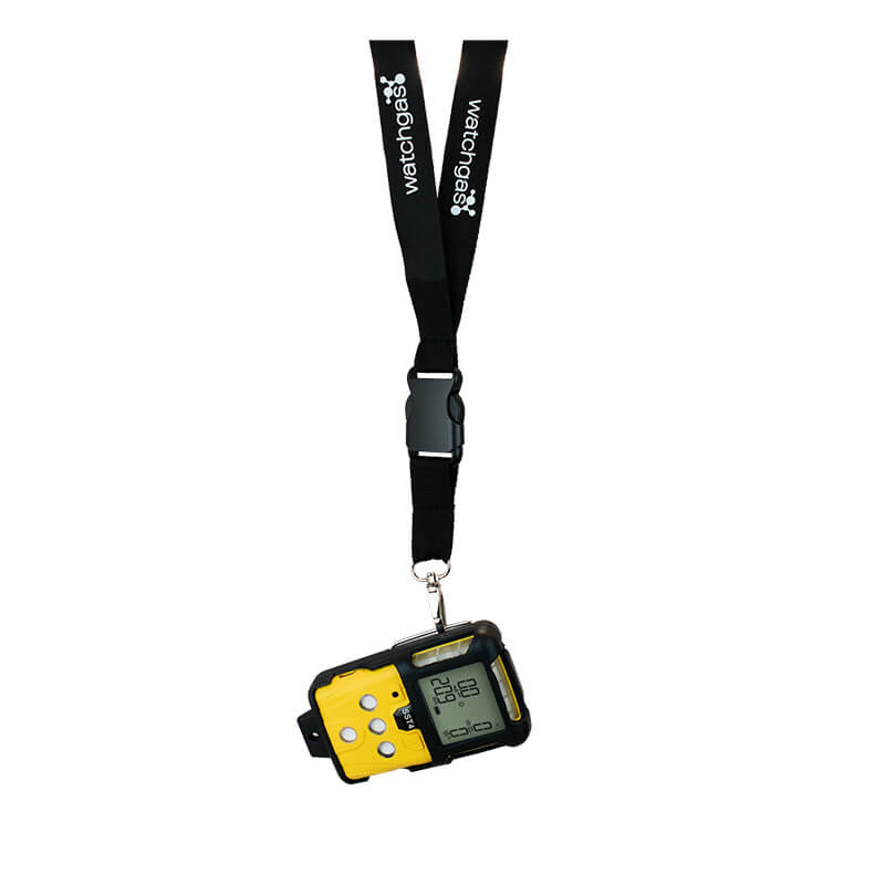 A WatchGas digital gas detector in yellow and black is secured with a durable WatchGas Neck Lanyard featuring a breakaway safety design and “watchgas” printed in white. Trusted SST accessories are included, and readings are shown on the device’s small display screen.