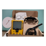 The WatchGas SST4-MICRO Diffusion 4-Gas Detector by WatchGas is shown in an open box with a black strap, clip, and instruction manual—perfect for gas safety monitoring.
