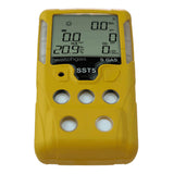 A yellow handheld WatchGas SST5 Diffusion 5-Gas Detector (LPC/O2/CO/H2S/SO2) features a digital display showing real-time gas concentration levels. Four circular sensor ports are located below the screen, making this portable device an essential tool from WatchGas for workplace safety and effective detection of multiple gases.