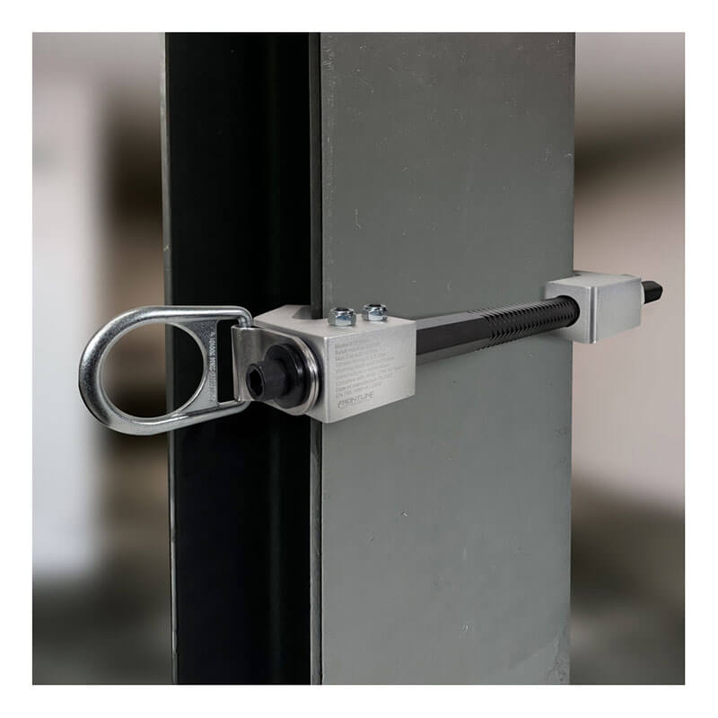 A close-up of the Frontline Aluminum 18" Vertical Fixed Beam Anchor ST18AV by Frontline Fall Protection, featuring a circular D-ring swivel, securely fastened to a vertical steel beam. The blurred background highlights the clamp mechanism.