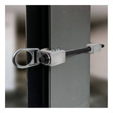 A close-up of the Frontline Aluminum 18" Vertical Fixed Beam Anchor ST18AV by Frontline Fall Protection, featuring a circular D-ring swivel, securely fastened to a vertical steel beam. The blurred background highlights the clamp mechanism.