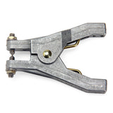 Detailed view of the Stewart R. Browne Ground Clamp, REB2960, showcasing its rugged industrial design. It includes a central pivot, stainless steel contacts, and a screw mechanism at the top with a golden handle. The gray clamp has a textured surface that highlights its durability.