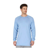 A man wears the ForgeFR Forge FR Crew Neck Tee MFRCNT-009, a light blue, long-sleeve flame resistant shirt, standing with hands at his sides against a plain white background—ideal for dependable FR protection.