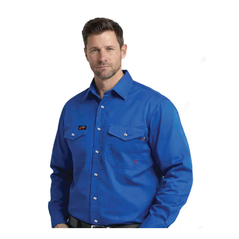 A man with short brown hair and a trimmed beard wears a bright blue ForgeFR Forge FR Solid Shirt MFRSLD-002 with front pockets, standing against a plain white background.