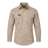 The ForgeFR MFRSLD-002 is a beige, long-sleeve, flame-resistant shirt with buttoned cuffs/front, two chest flap pockets, and a "FORGE FX" name patch above the left pocket. NFPA 2112 compliant for superior FR protection.
