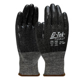 A pair of PIP G-Tek PolyKor Gloves with silicone-coated grips on the textured palms and fingers. The gloves display white text indicating cut resistance levels and standards. They feature a dark grey cuff with a brown band at the wrist.