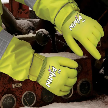 Yellow gloves with 'Ninja' branding on a snowy background