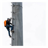 A worker in safety gear and an orange backpack climbs a tall metal pole with fixed ladder rungs, secured by a Frontline Ladder Cable Vertical Lifeline System VLCS from Frontline Fall Protection, against a white sky background.