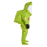 A person in a bright green Dupont Tychem 10000 Commander EX Level A Suit TK555T with a clear face shield, black gloves, and covered shoes stands in profile view against a white background.