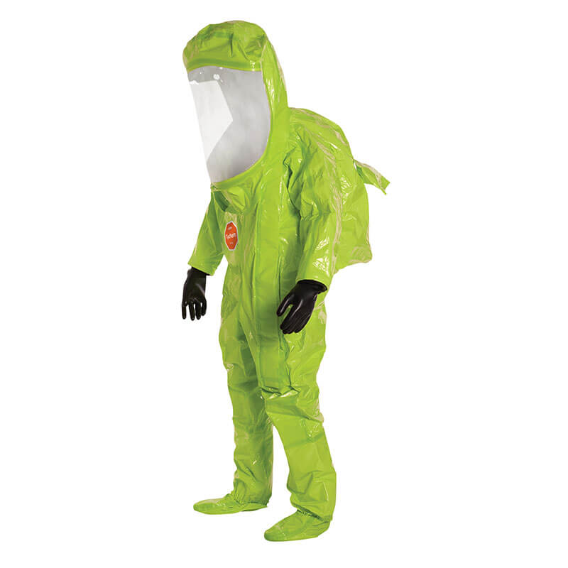 A person in a Dupont Tychem 10000 Commander EX Level A Suit TK555T with a clear face shield and black gloves stands against a plain white background.