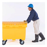 An individual wearing a blue hard hat, blue shirt, beige pants, and black boots is pushing the UltraTech Utility Box 086_, a large yellow utility box with wheels from UltraTech International. The background is white.